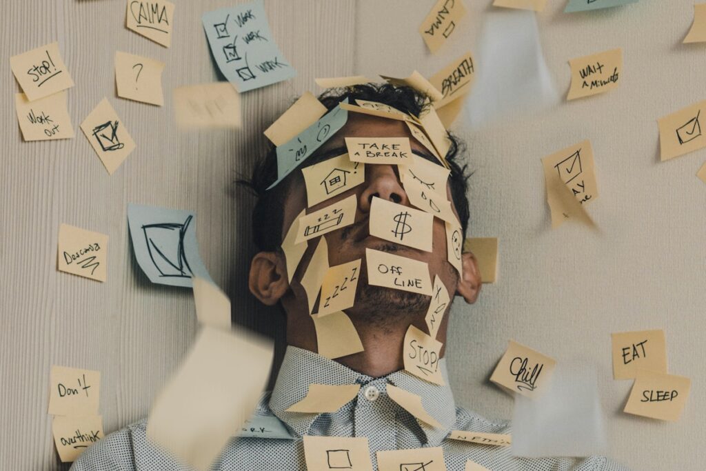 Young man covered in sticky notes, work overload image 8 1