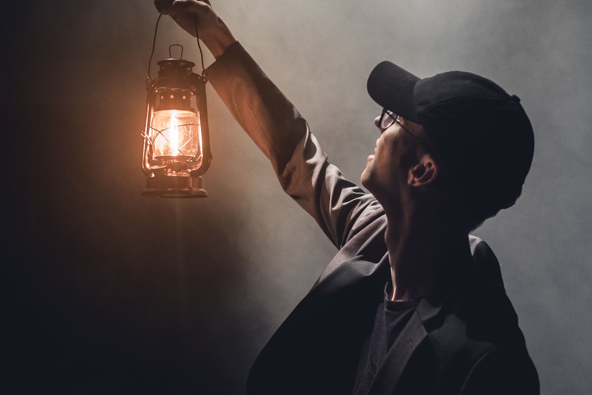 Stage Spotlight meets man with lantern Stage Spotlight meets man with lantern