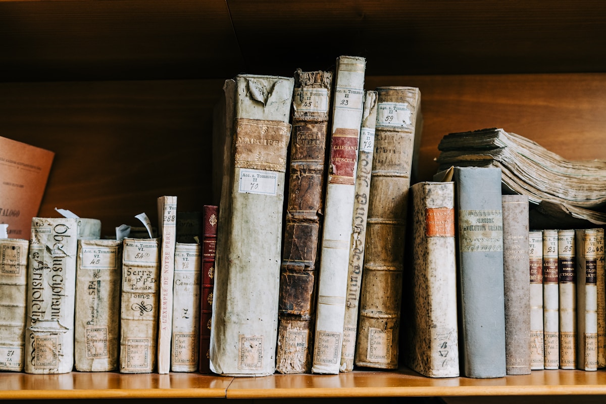 A bookshelf full of antique books A bookshelf full of antique books